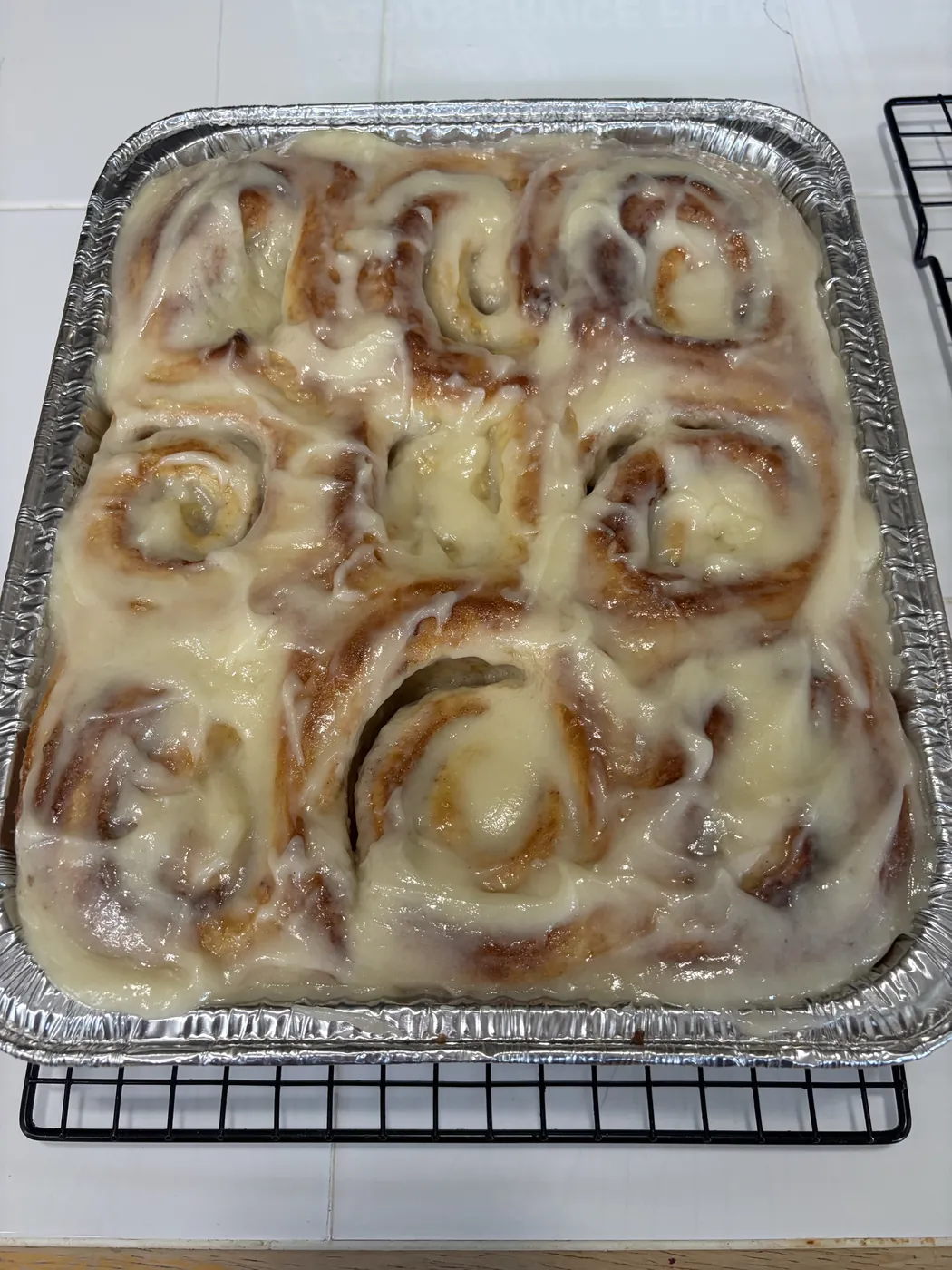 Pan of iced cinnamon rolls