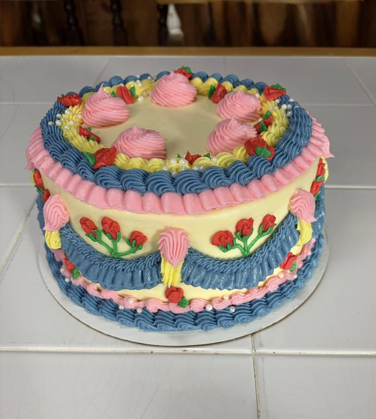 Vintage Lambeth piped cake in pink, blue and yellow