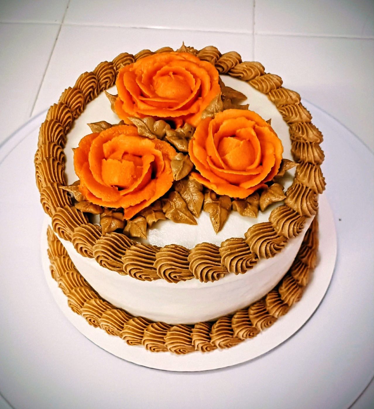 Mocha buttercream cake with orange roses